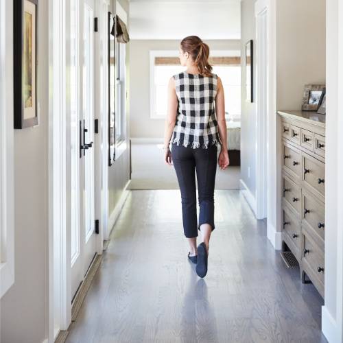 woman walking on laminate flooring